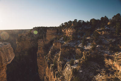 Scenic view of cliff against clear sky