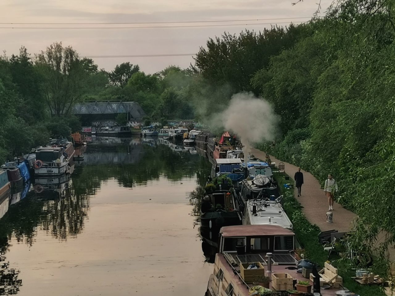 HIGH ANGLE VIEW OF BOATS IN RIVER AGAINST SKY