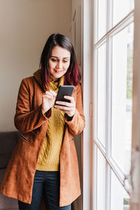 Young woman using mobile phone