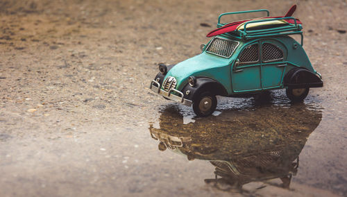 Toy car on wet ground