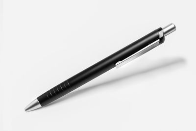 High angle view of pen on table against white background