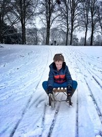 Girl sitting in snow