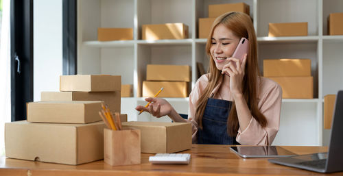 Entrepreneur talking on phone at office