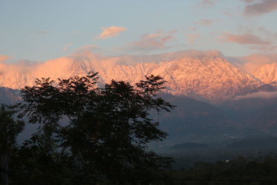 Scenic view of mountains against sky during sunset