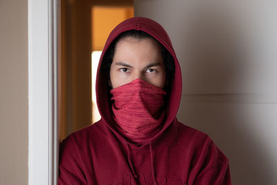 Close-up portrait of a person covering face