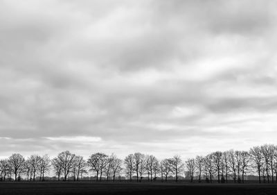 Cityscape against cloudy sky