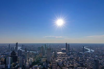 Aerial view urban tower bangkok city thailand ,sun and blue sky background , cityscape thailand