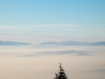 Scenic view of mountains against sky during sunset