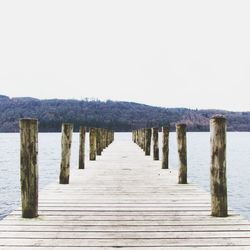 Pier over sea against sky