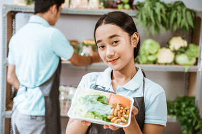 Midsection of woman holding food