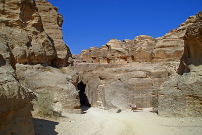 Rear view of people on rock formation