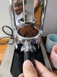 Close-up of hand holding coffee