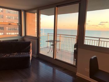 Scenic view of sea seen through home window