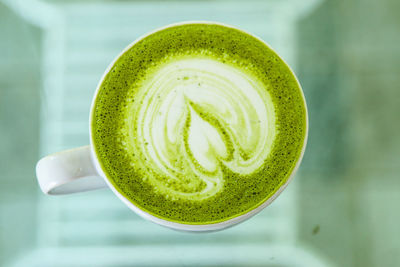 Close-up of coffee or green tea cup