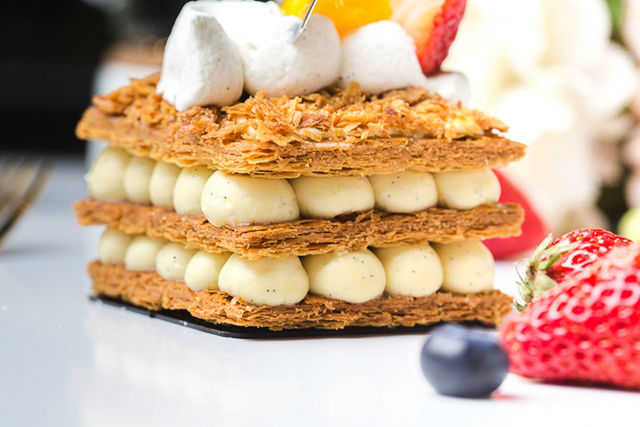 CLOSE-UP OF CAKE WITH BREAD IN PLATE