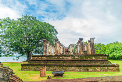 View of old temple against cloudy sky