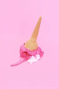 Close-up of ice cream against pink background