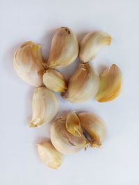 Close-up of garlic on white background