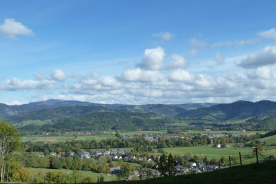 Scenic view of agricultural field against sky