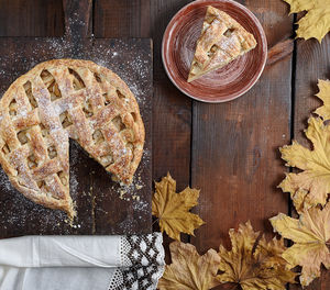 High angle view of pie with leaves on table