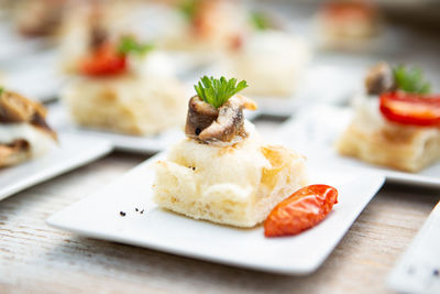 Close-up of pizza and focaccia in plate on table