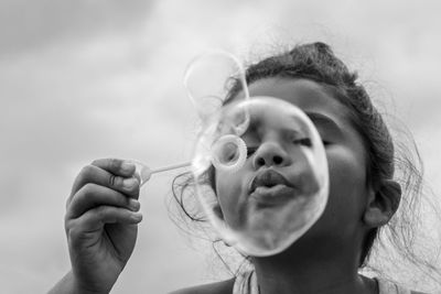 Close-up portrait of girl holding ice cream