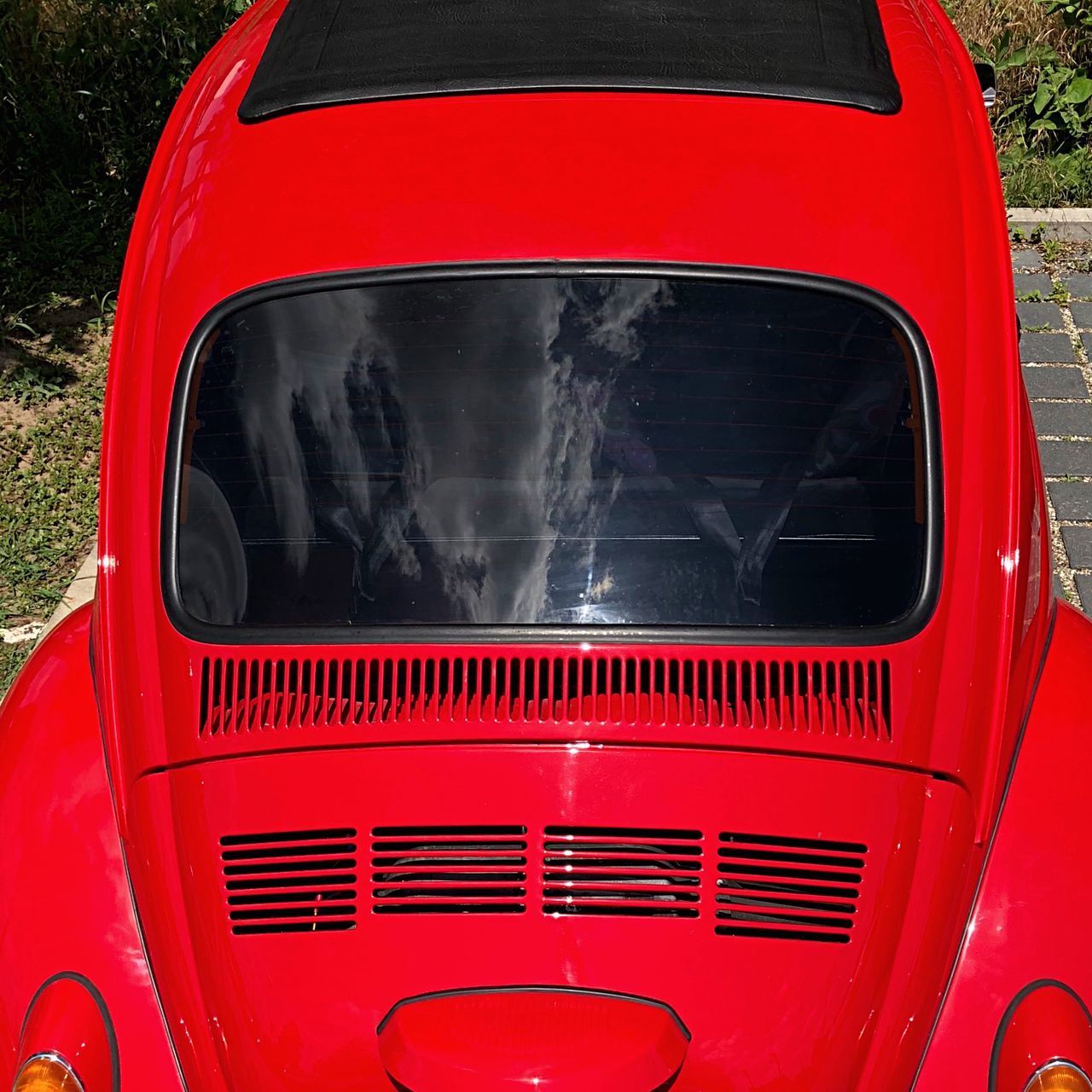 CLOSE-UP OF RED VINTAGE CAR