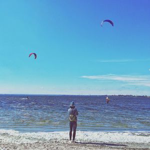 Parachuting at calm blue sea