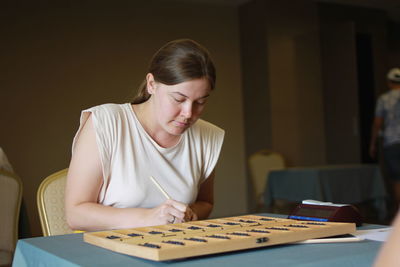 Young woman using laptop at home