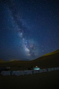 Scenic view of star field against sky at night