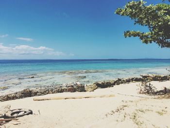 Scenic view of sea against blue sky