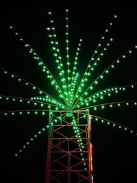 Low angle view of illuminated lights at night