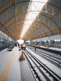 People waiting at railroad station platform