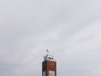 Low angle view of tower against cloudy sky