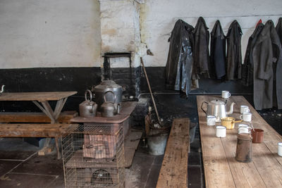 Clothes hanging on old table at home