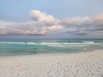 Scenic view of beach against sky during sunset