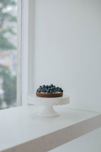 Blueberry cake on window sill