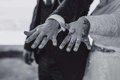 Midsection of woman with text on hands