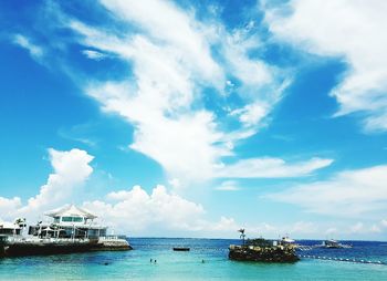 Scenic view of sea against cloudy sky