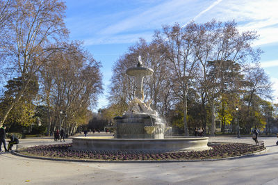 Fountain in park against sky