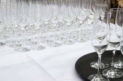 Close-up of wine glasses on table