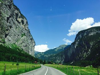 Country road leading towards mountains