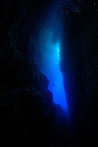 Low angle view of rock formation in sea