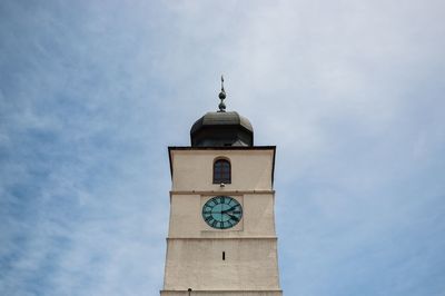 Low angle view of clock tower against sky