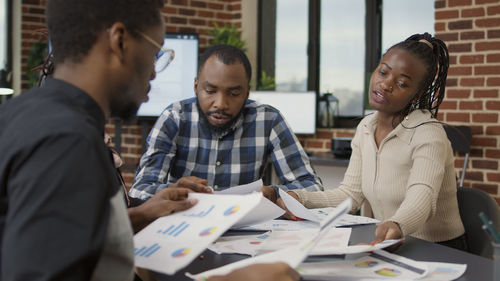 Business colleagues working in office