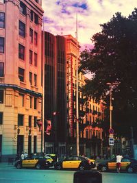 Buildings against cloudy sky