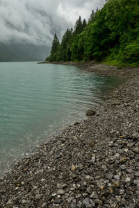 Scenic view of sea against cloudy sky