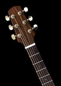 High angle view of guitar against black background