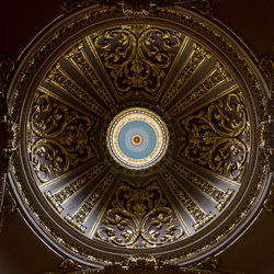 Low angle view of ornate ceiling in temple