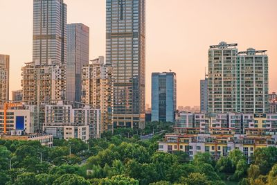 Buildings in city against sky